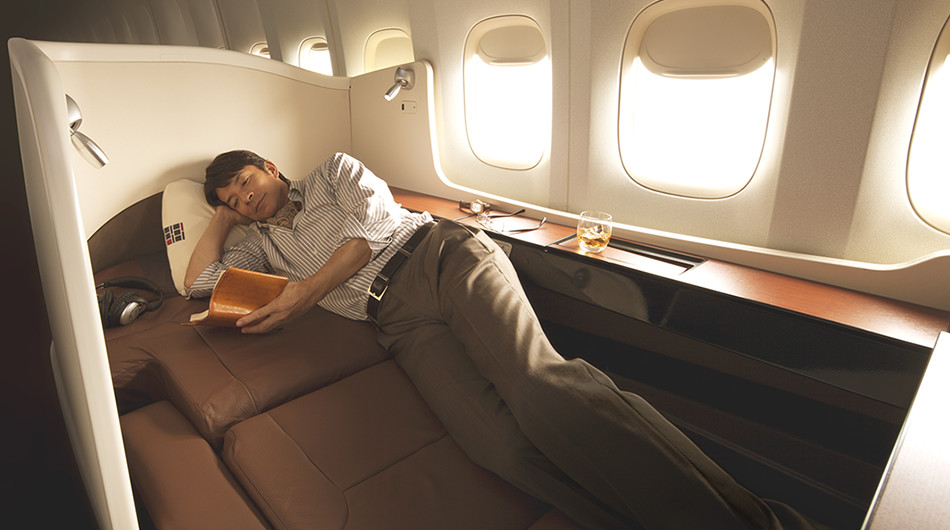 a man sleeping on a plane