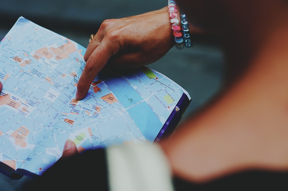 a person pointing at a map