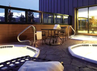 a hot tubs and a table on a patio