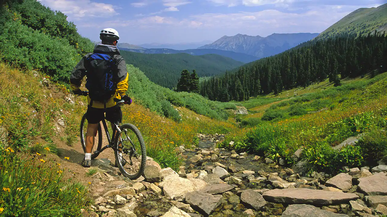 a man on a bicycle on a rocky trail