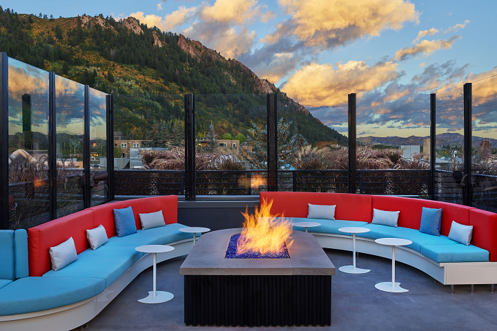 a fire pit with a mountain in the background