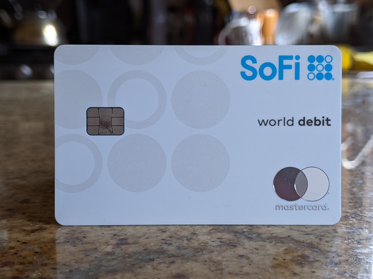 a white card with blue and white circles on a counter