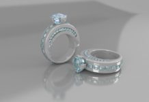 a pair of silver rings with blue stones
