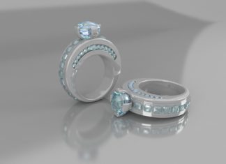 a pair of silver rings with blue stones