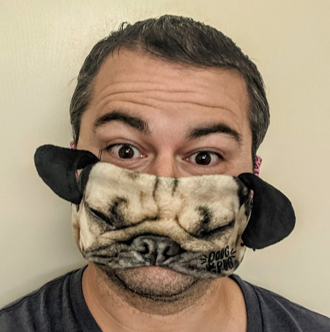 a man wearing a dog mask