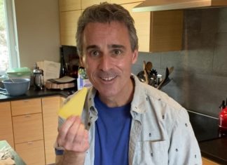 a man holding a piece of cheese