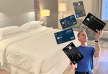 a man juggling credit cards in a hotel room