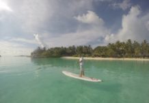 a man on a surfboard in the water