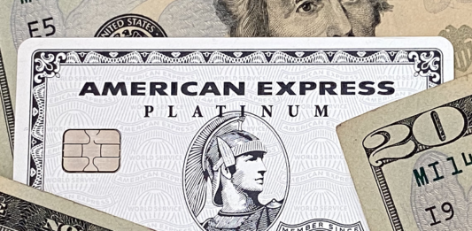 a credit card with a chip and a chip on top of money