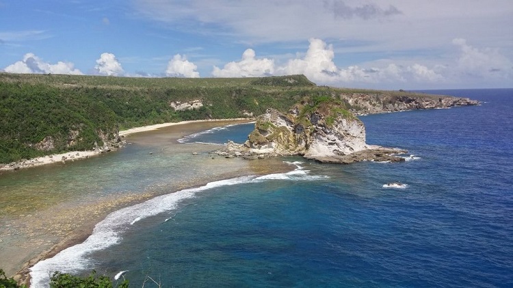 a beach with rocks and water