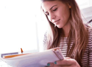 a woman looking at a paper