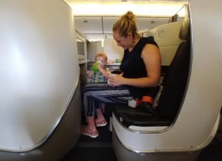 a woman feeding a baby