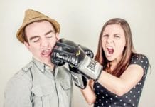 a man and woman with boxing gloves