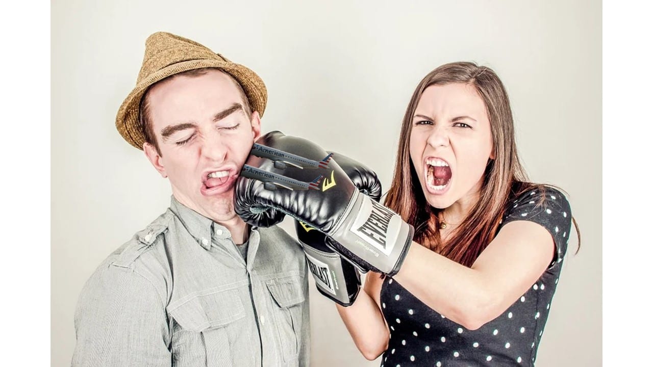 a man and woman with boxing gloves