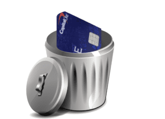 a credit card in a trash can