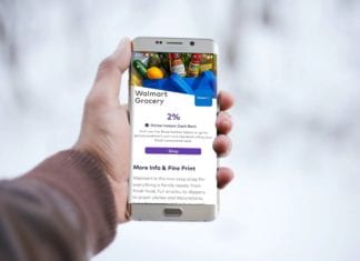 a hand holding a cell phone