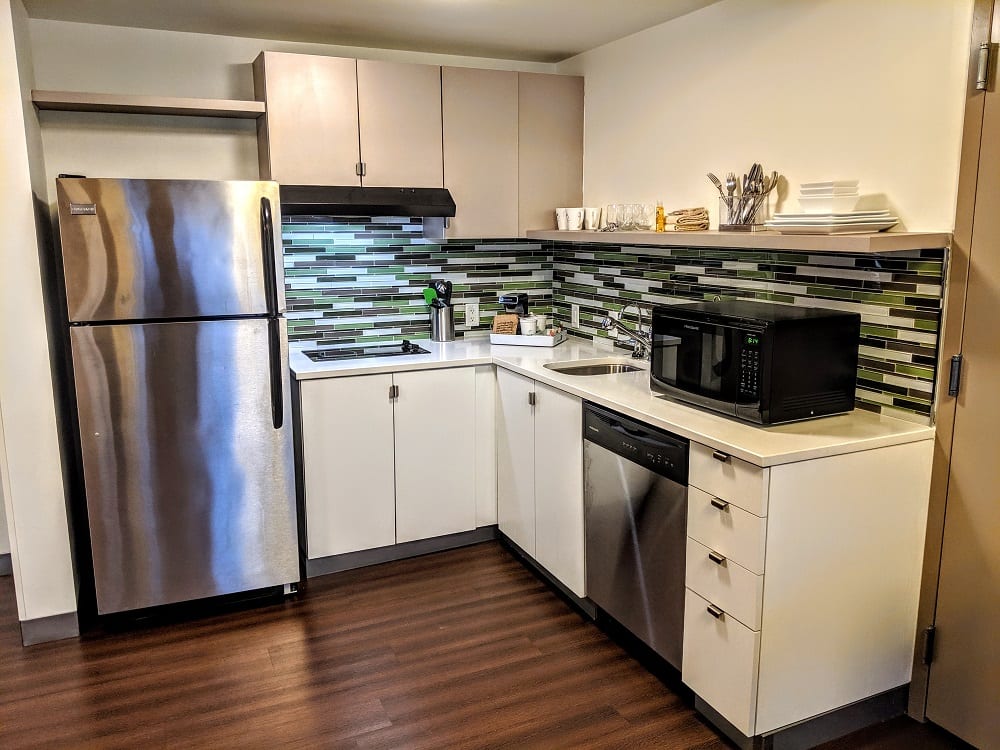 a kitchen with a microwave and stainless steel appliances