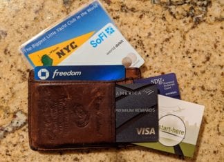 a wallet with credit cards and cards in it
