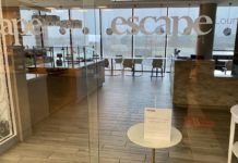 a glass wall with a sign on it