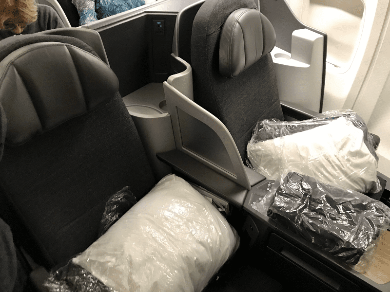 a seat with plastic bags and a plastic bag inside