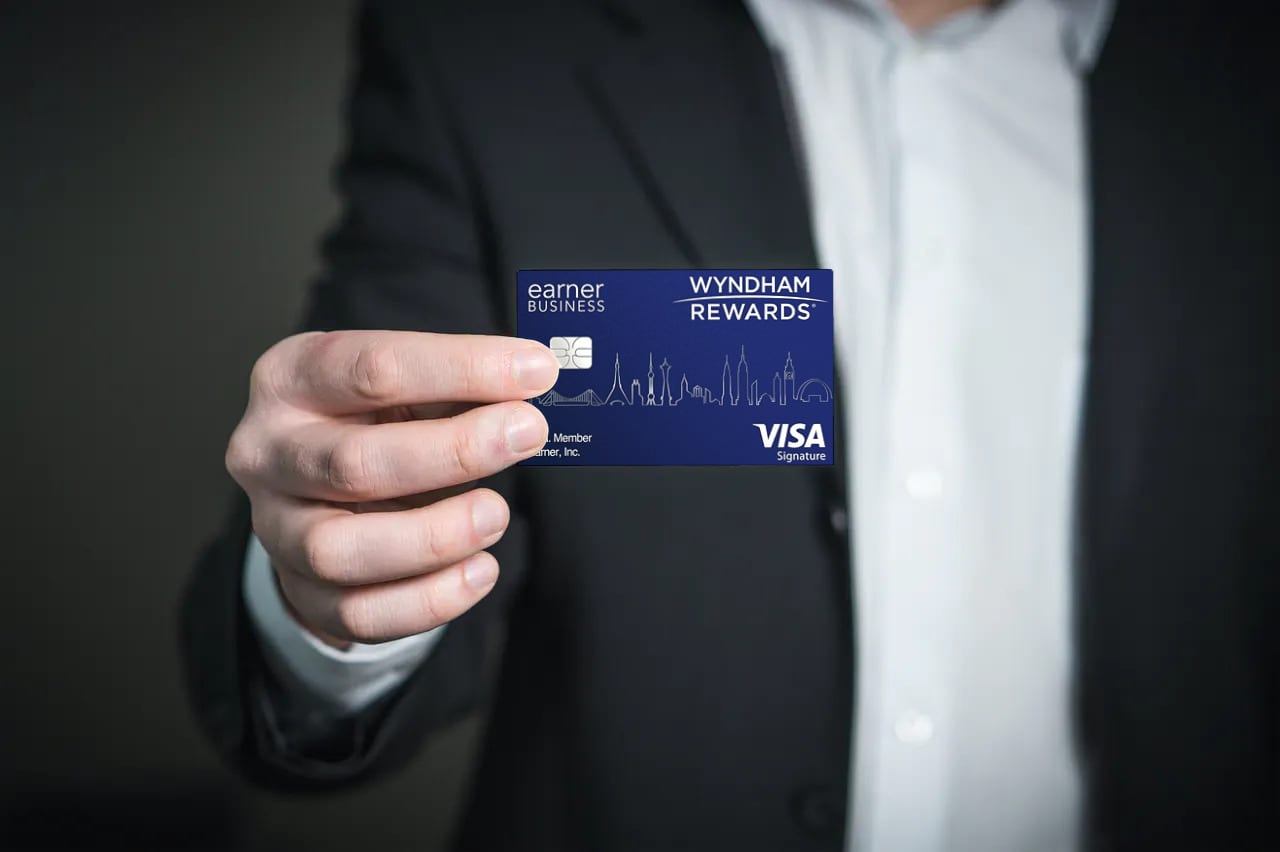 a person holding a blue card