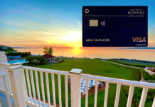 a credit card on a deck overlooking a golf course
