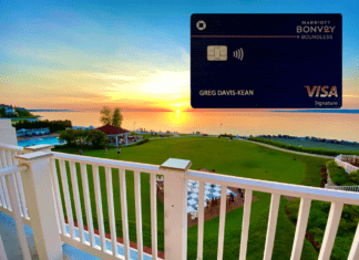 a credit card on a deck overlooking a golf course