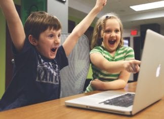 Children computer happy celebrating