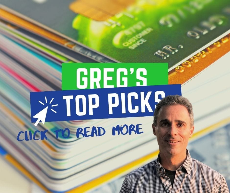 a man standing in front of a stack of credit cards