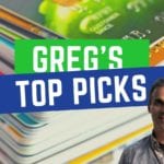 a man standing in front of a stack of credit cards