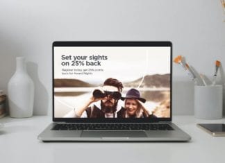 a laptop with a picture of a man and a woman looking through binoculars