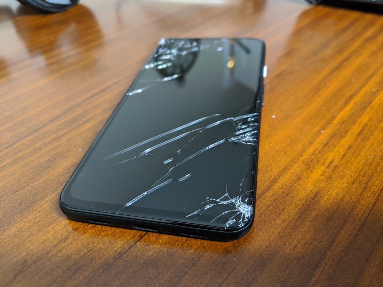 a broken cell phone on a table