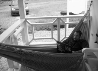 a man sitting in a hammock