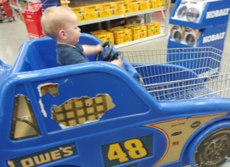 a baby in a toy car
