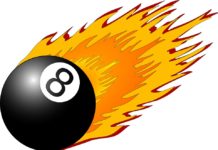 a black billiard ball with white number eight on fire