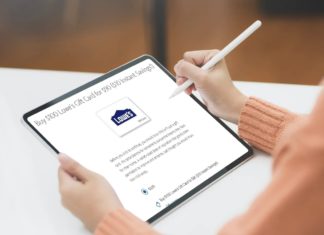 a person holding a stylus and a tablet