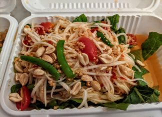 a salad in a styrofoam container