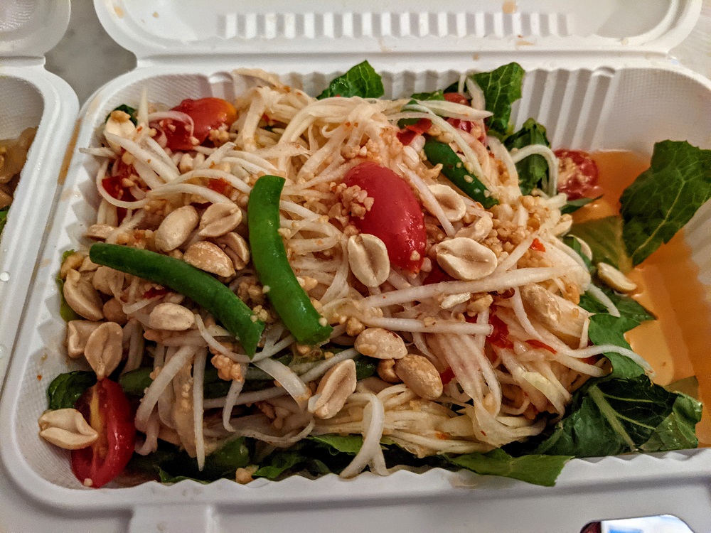 a salad in a styrofoam container