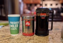 a coffee maker and a mug of coffee
