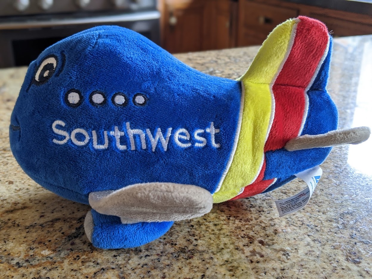 a blue airplane stuffed toy on a counter
