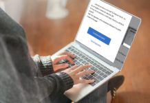 a person typing on a laptop