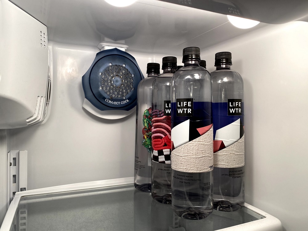 a group of bottles in a refrigerator