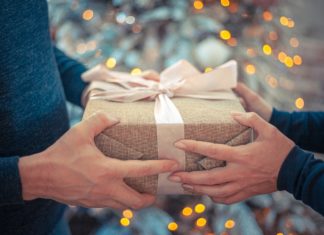 a person holding a wrapped present