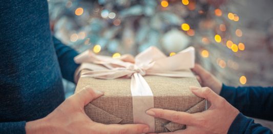a person holding a wrapped present