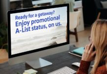 a woman sitting at a desk with a computer