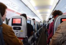 a group of people sitting in an airplane