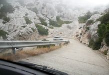 a car driving on a mountain road