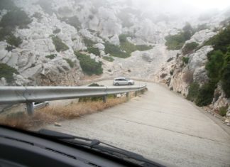 a car driving on a mountain road