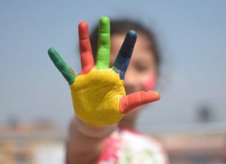 a child with painted hand