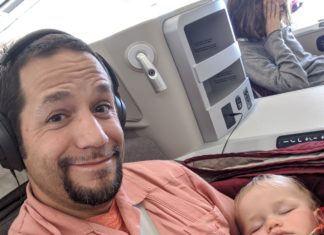 a man taking a selfie with a baby